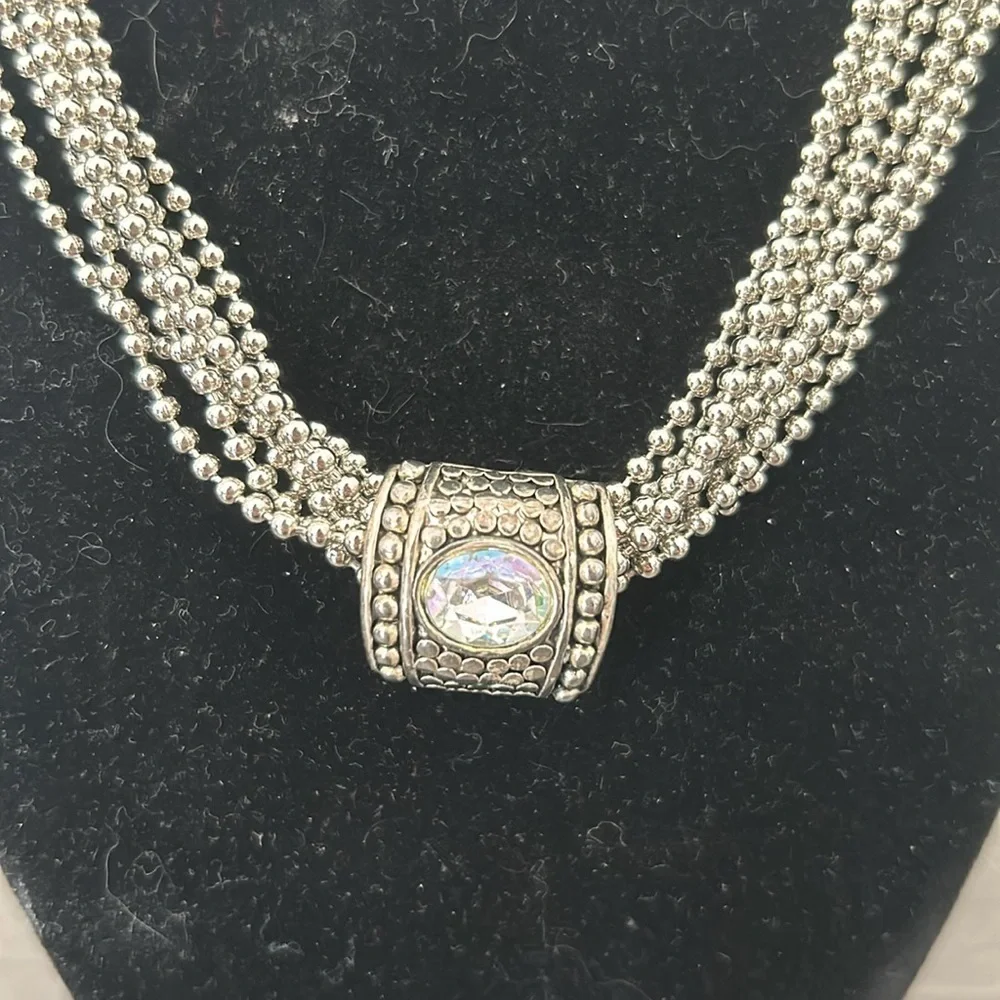 Gorgeous silver strand necklace with crystal slide